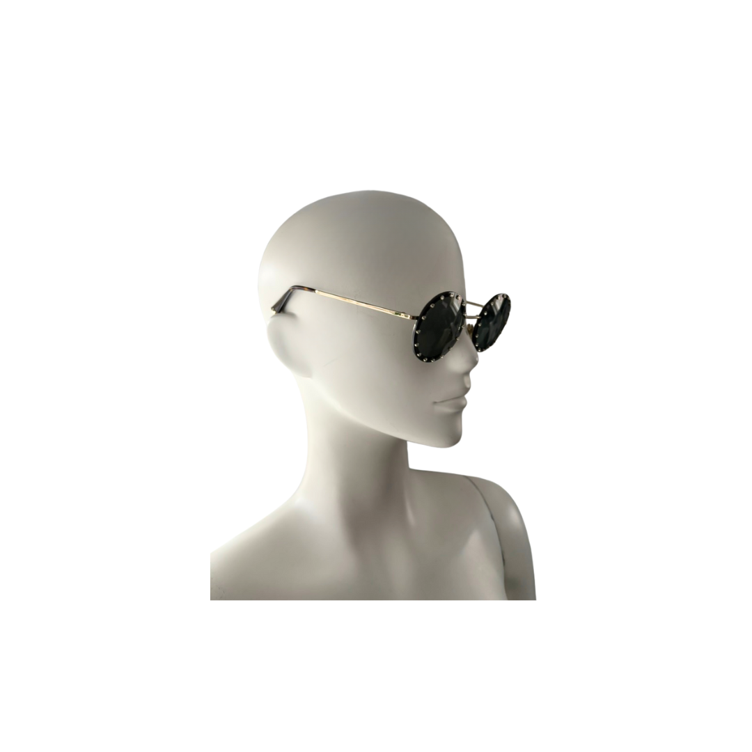 Sunglasses on a mannequin head against a white background
