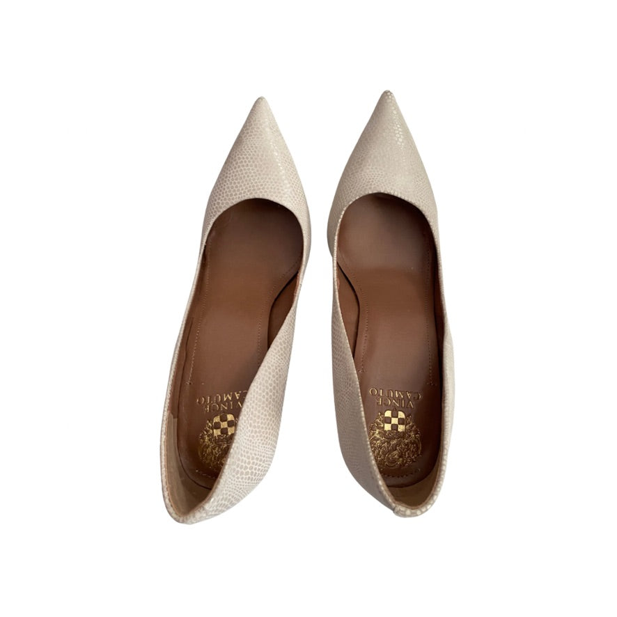 Pair of beige pointed-toe shoes on a white background