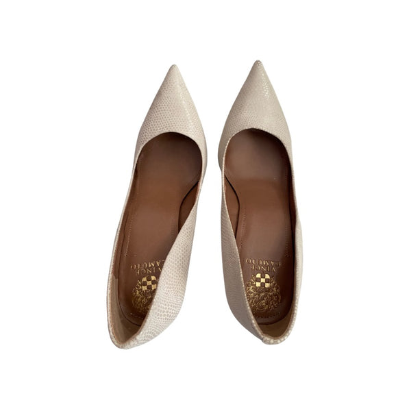 Pair of beige pointed-toe shoes on a white background