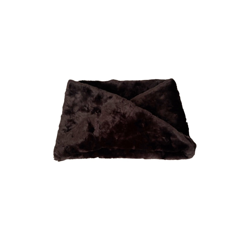 Dark brown fur headband on a white background