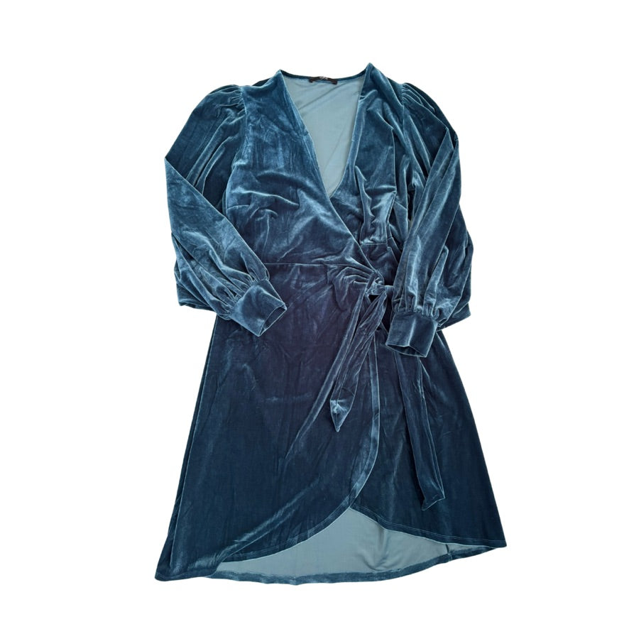 Blue velvet dress with a white background