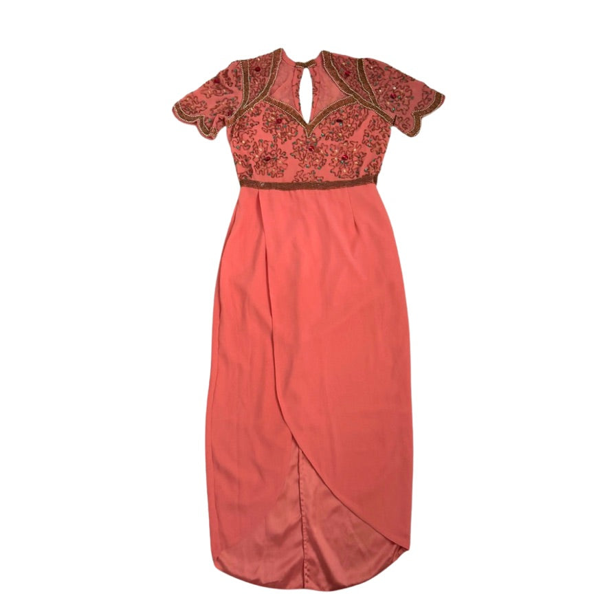 Coral evening gown with lace detailing on a white background