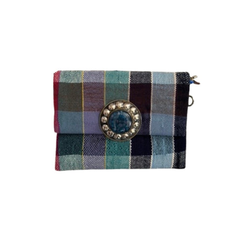 Plaid clutch bag with decorative clasp on a white background