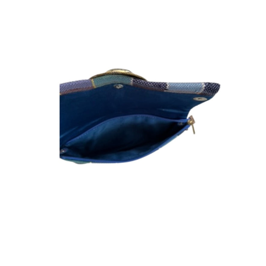 Blue lined handbag with a gold clasp on a white background