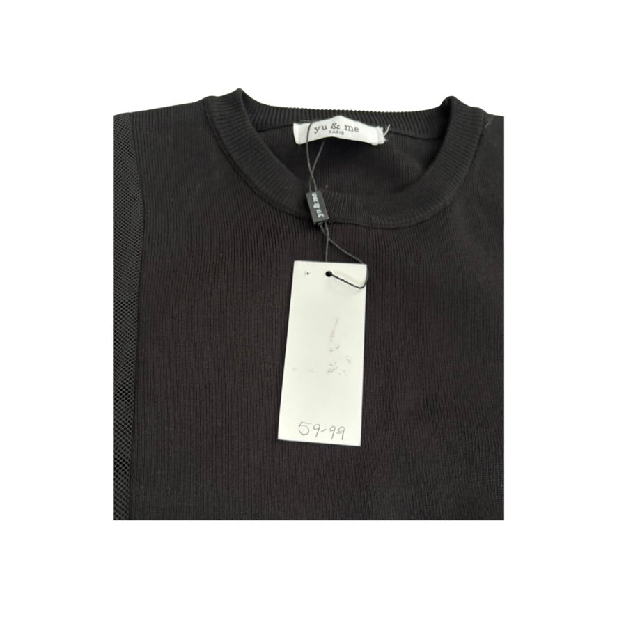Folded black shirt with a tag on a white background
