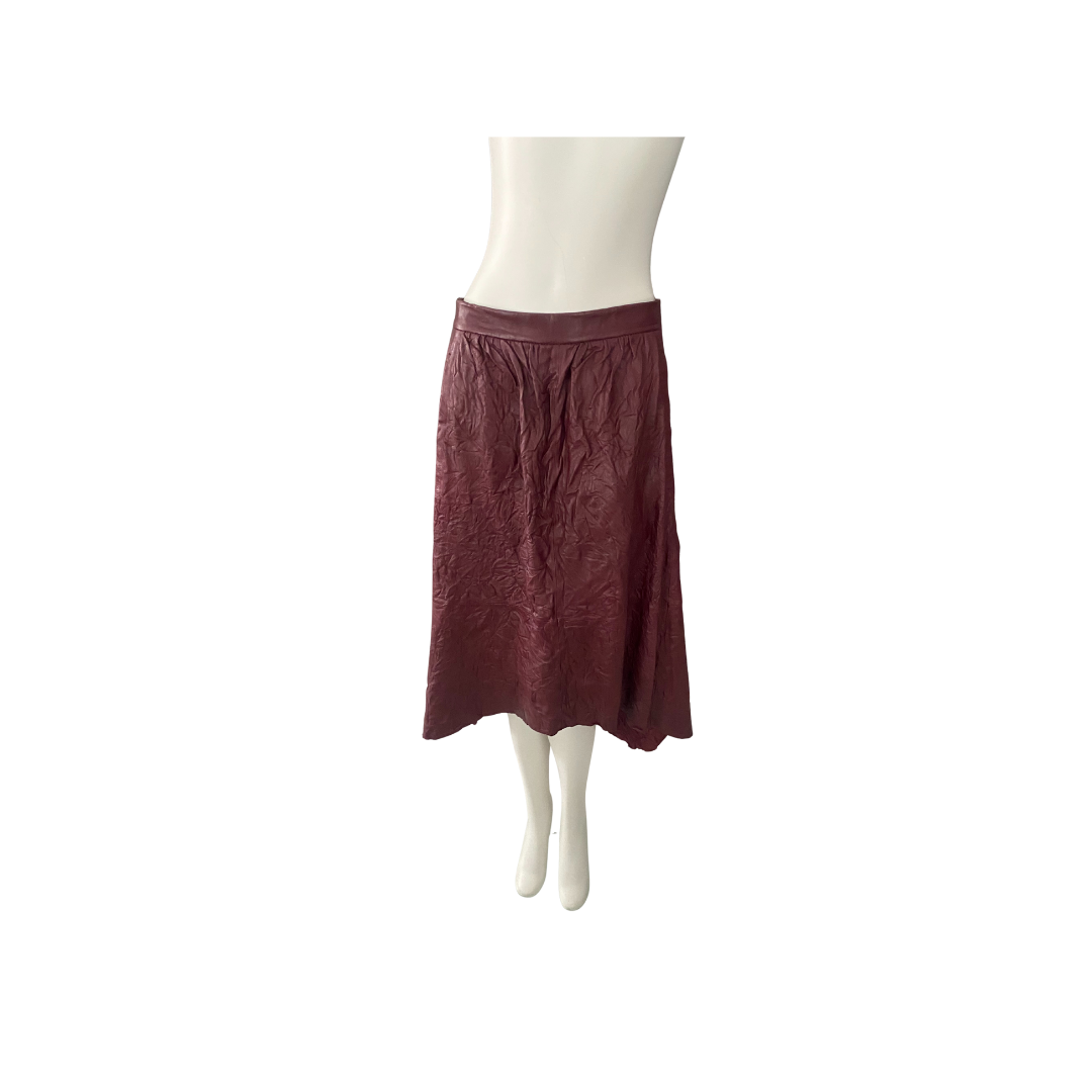 Maroon skirt on a mannequin against a white background