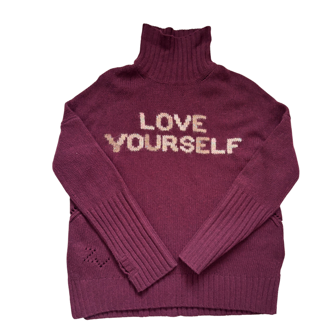 Burgundy
turtleneck sweater with 'LOVE YOURSELF' text on a white background