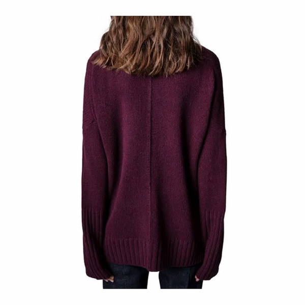 Burgundy sweater worn by a person on a white background