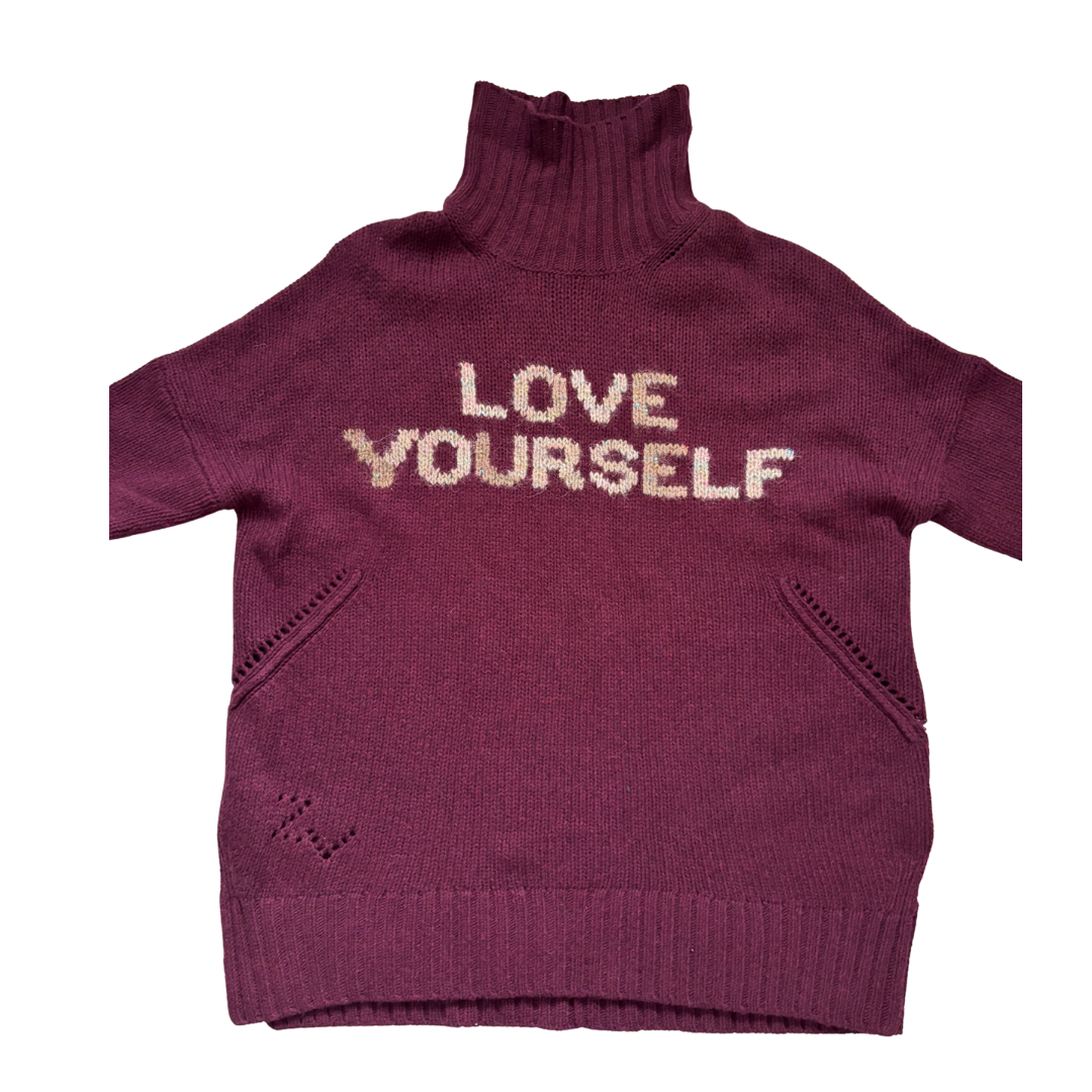 Burgundy sweater with 'LOVE YOURSELF' text on a white background