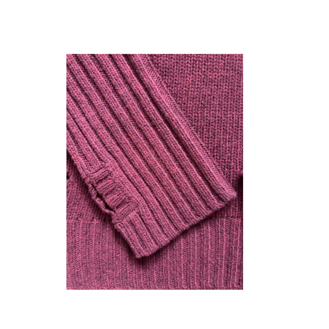 Burgundy sweater cuff on a white background