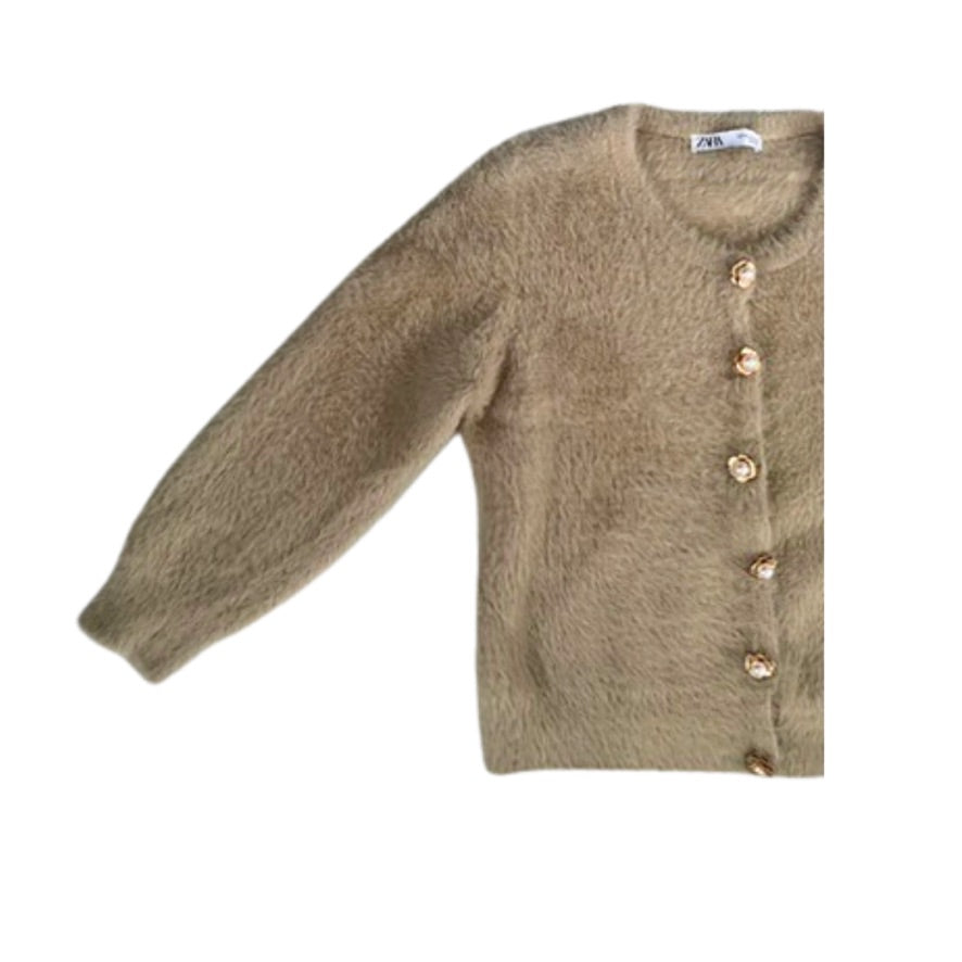 Beige cardigan with buttons on a white background