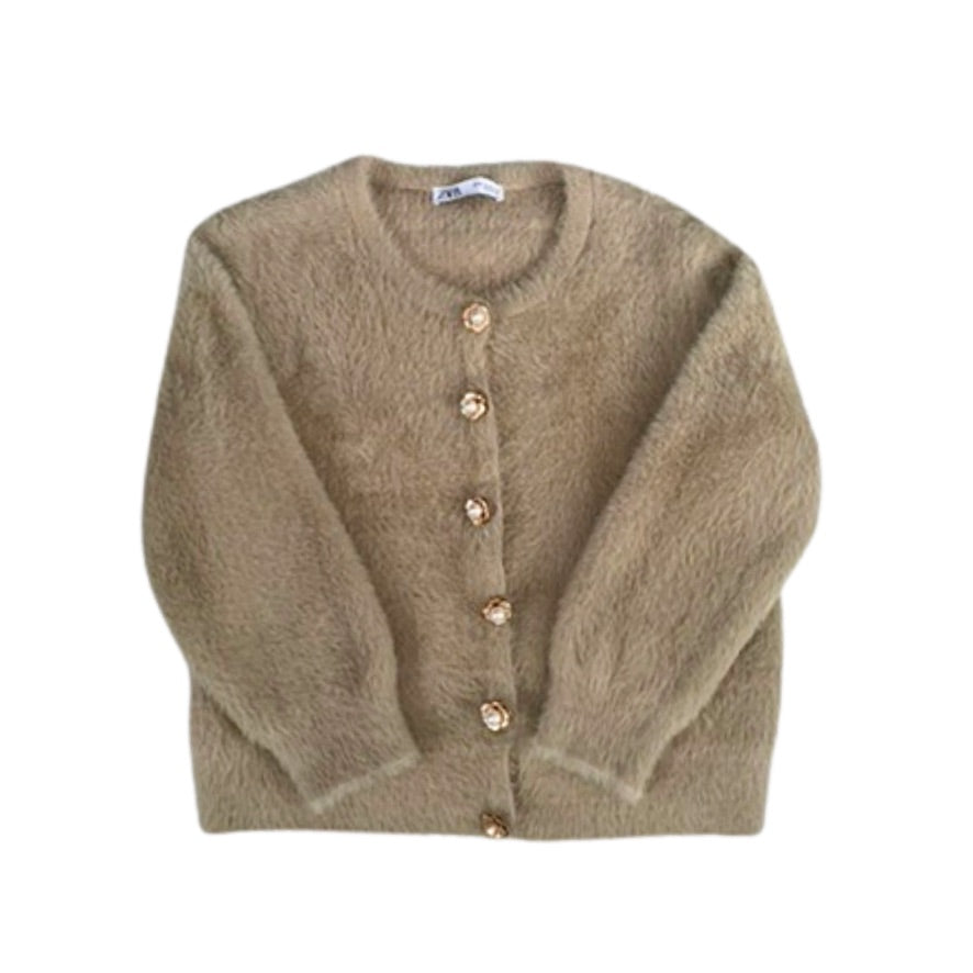 Beige cardigan with buttons on a white background