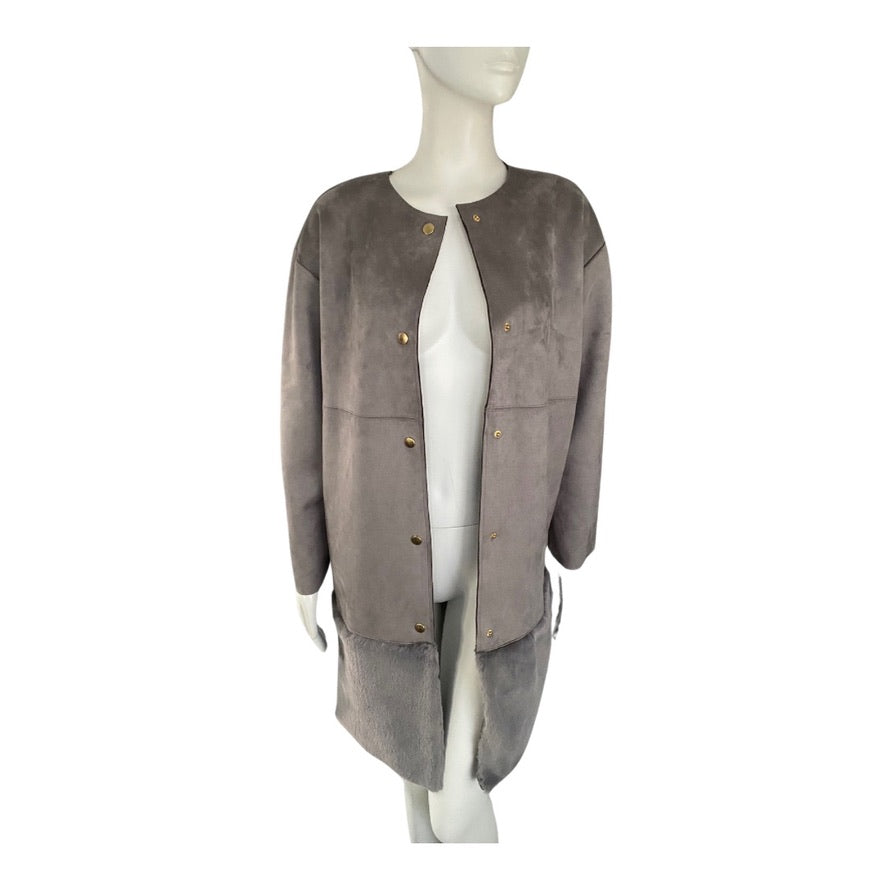 Mannequin wearing a gray suede jacket on a white background