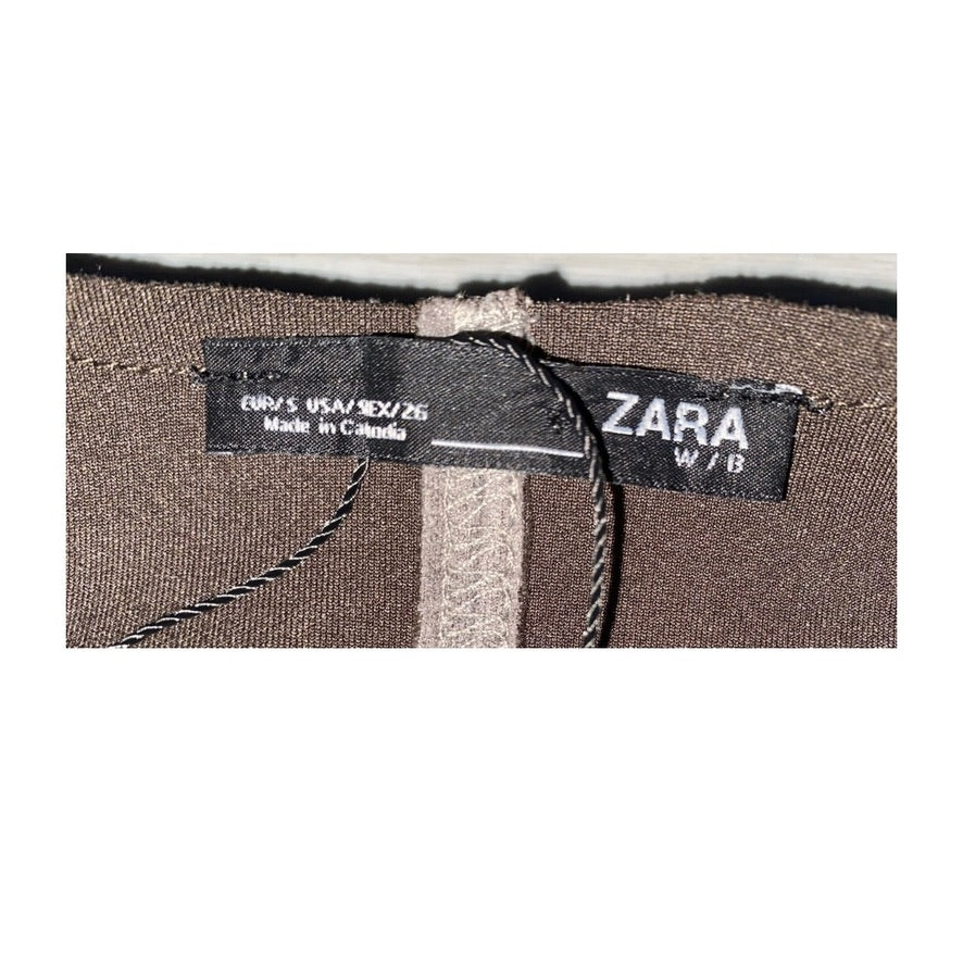 Zara label on a brown fabric background