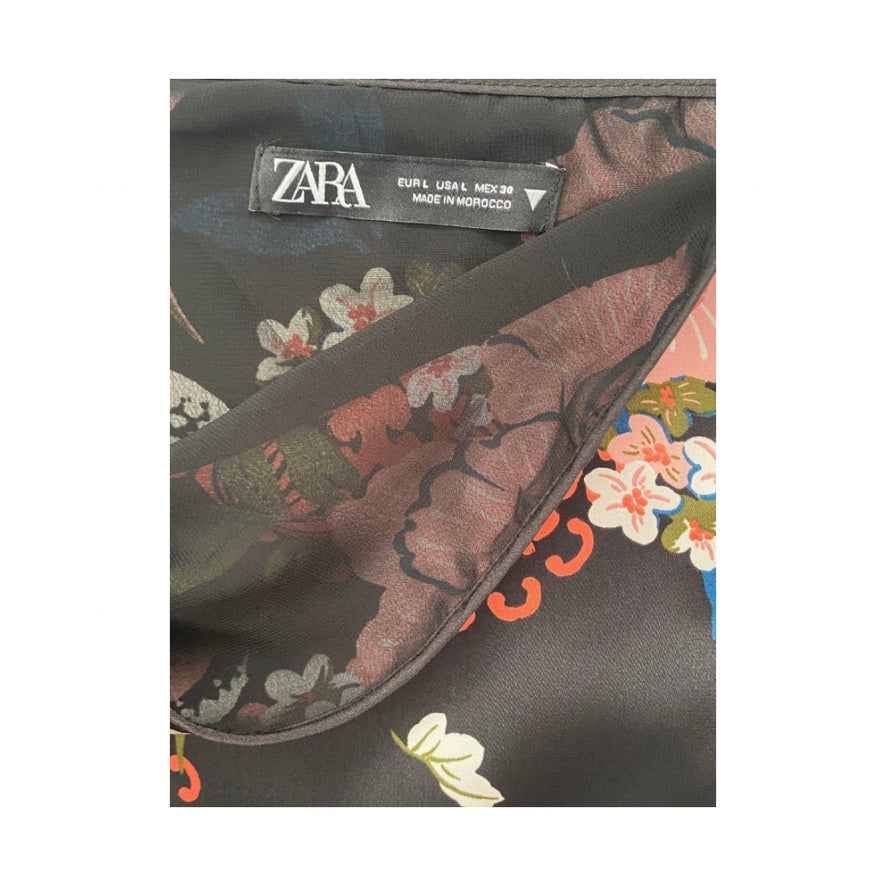 Zara label on a piece of fabric with floral patterns