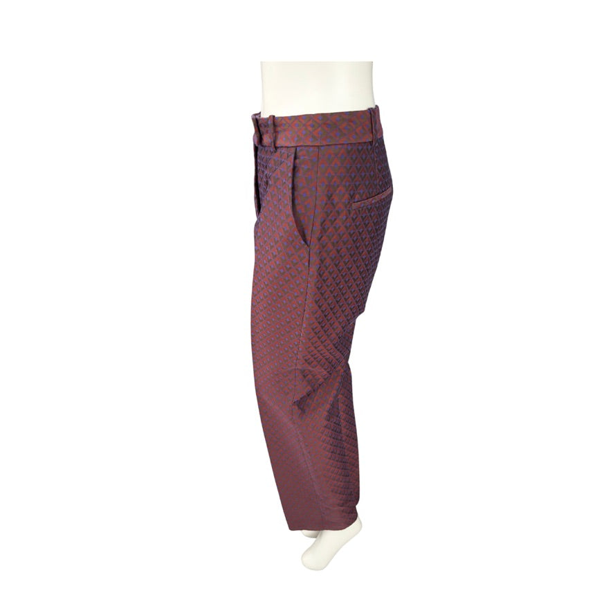 Maroon patterned pants on a mannequin against a white background