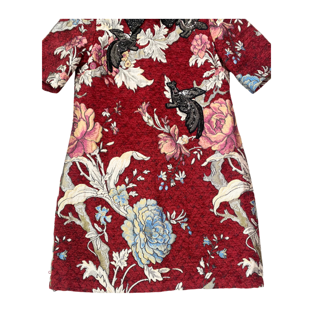 Floral dress with a red background on a white background