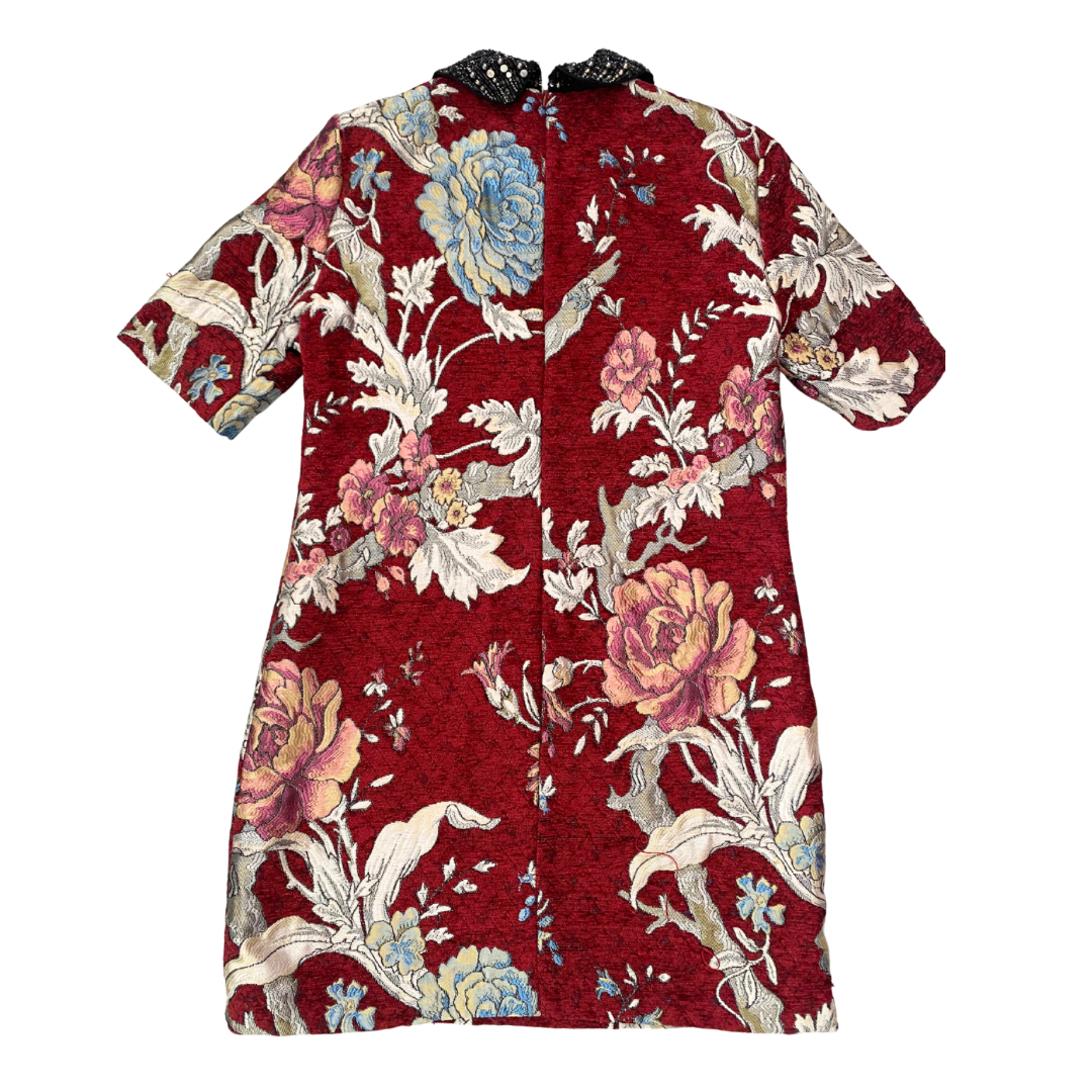 Red floral dress with a white background