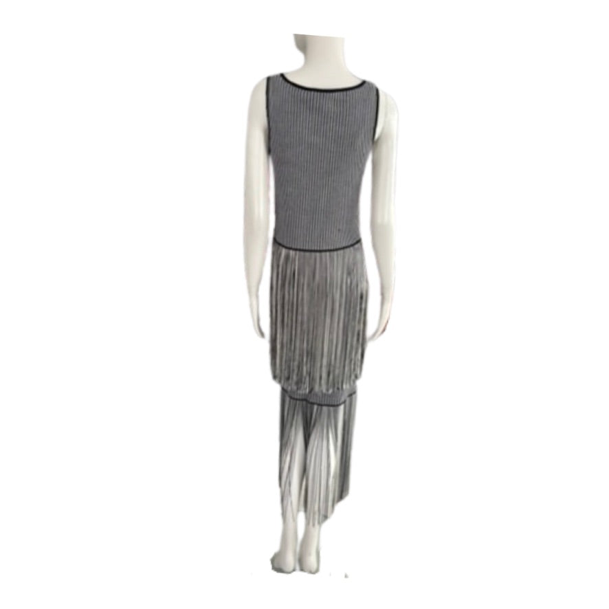 Mannequin wearing a gray dress with a pleated skirt on a white background