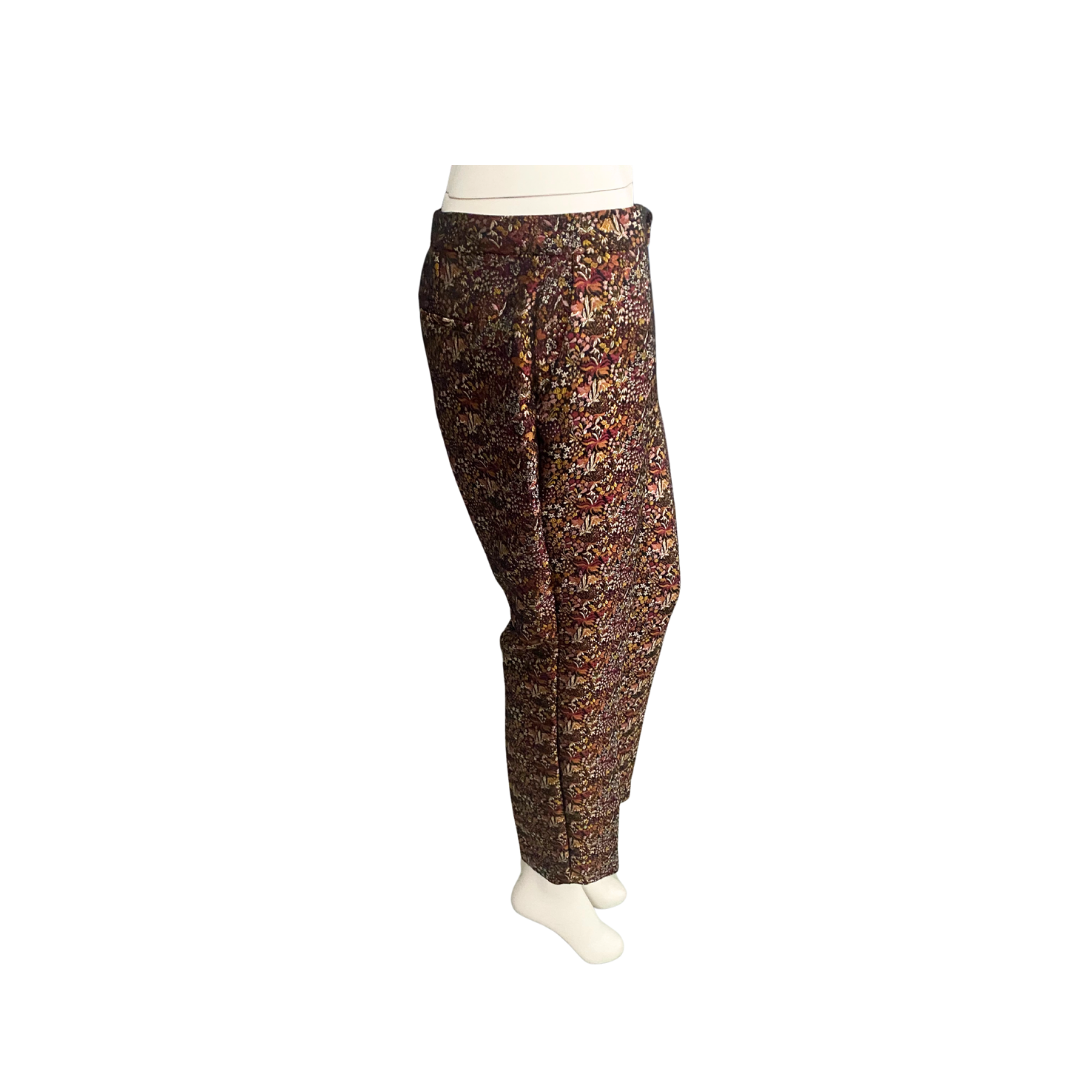 Floral patterned pants on a mannequin against a white background