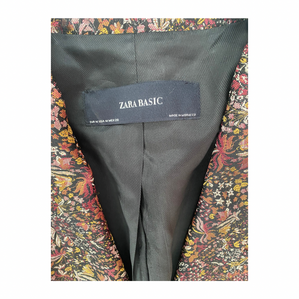 Zara Basic label on a dark gray fabric with a colorful floral patterned lining.