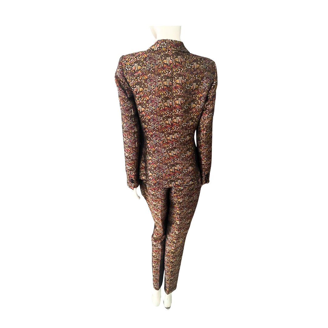 Floral patterned suit on a mannequin against a white background