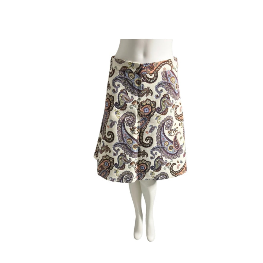 Patterned skirt on a mannequin against a white background