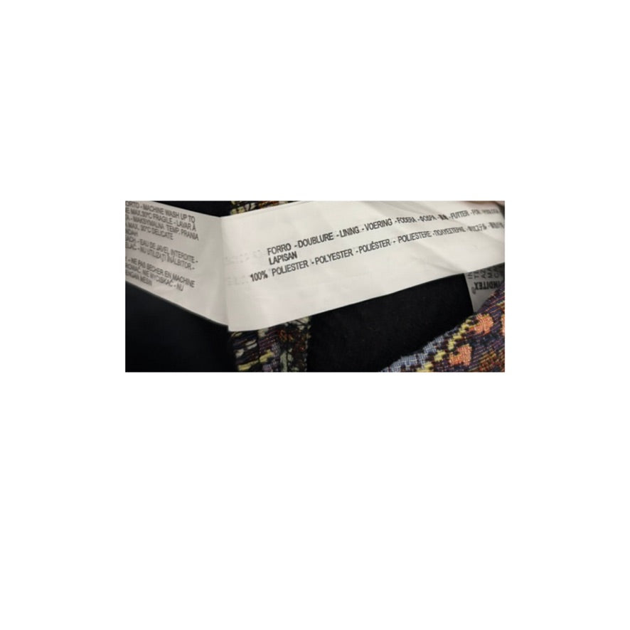 Close-up of a product packaging with text and design details on a white background