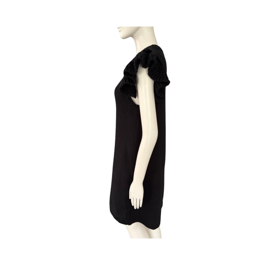 Black dress on a mannequin against a white background