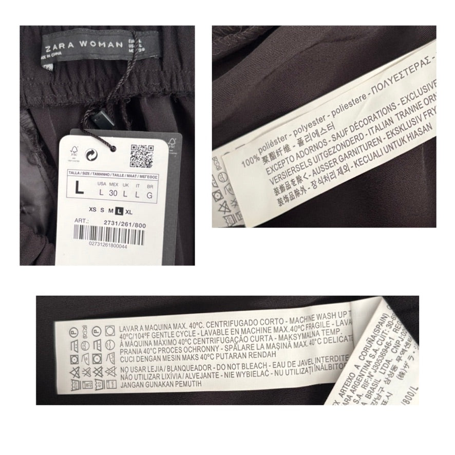 Close-up of Zara Woman clothing labels with brand name and size information.