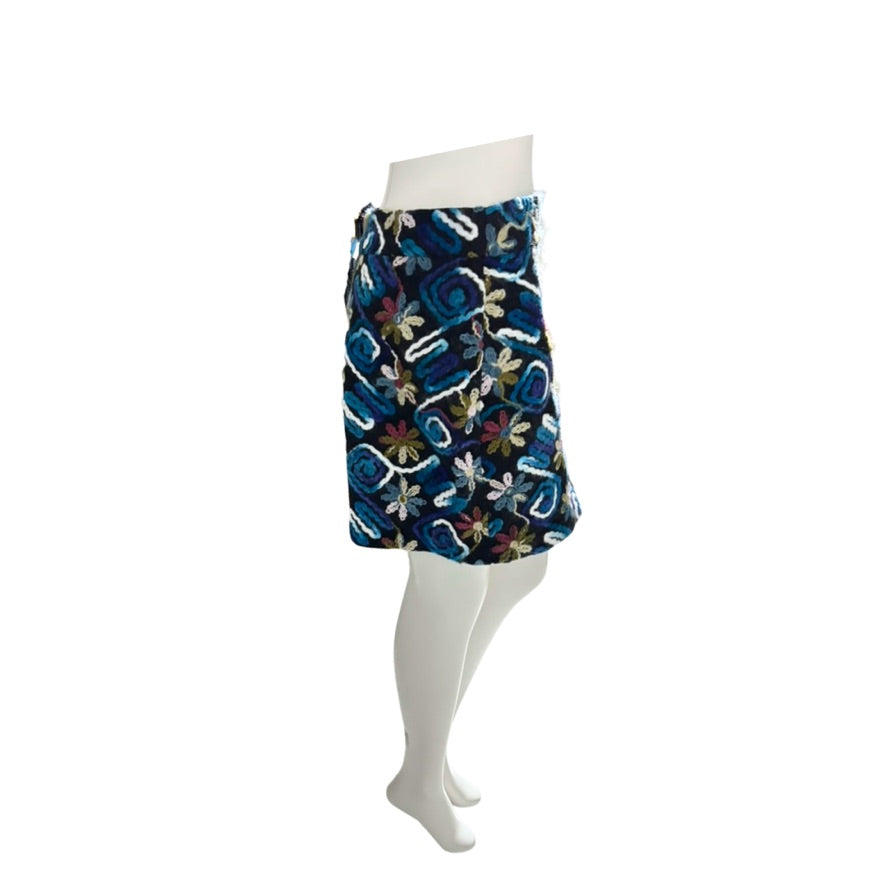 Skirt with a floral pattern on a mannequin against a white background