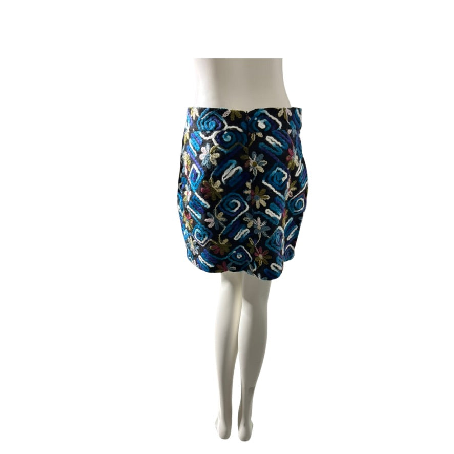 Floral patterned skirt on a mannequin against a white background