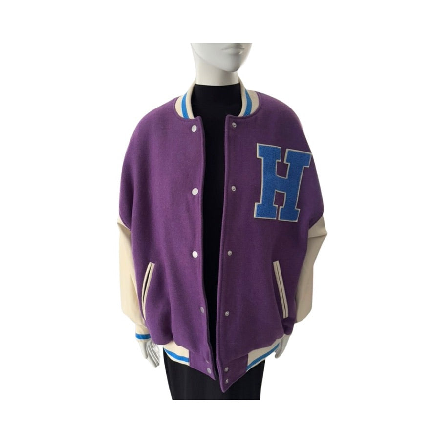 Purple varsity jacket with a large 'H' on a mannequin against a white background