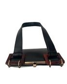 Black leather belt with gold buckle on a white background