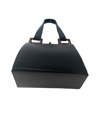 Black handbag with a strap on a white background