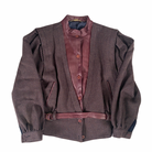 A vintage 80s checkered jacket with contrasting leather bib and belt, navy blue sleeves, and a high collar.