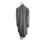 Plaid shirt on a mannequin against a white background