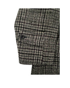 Close-up of a houndstooth patterned fabric on a white background