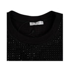 Black sweater with rhinestone details and 'AREA' label on a white background