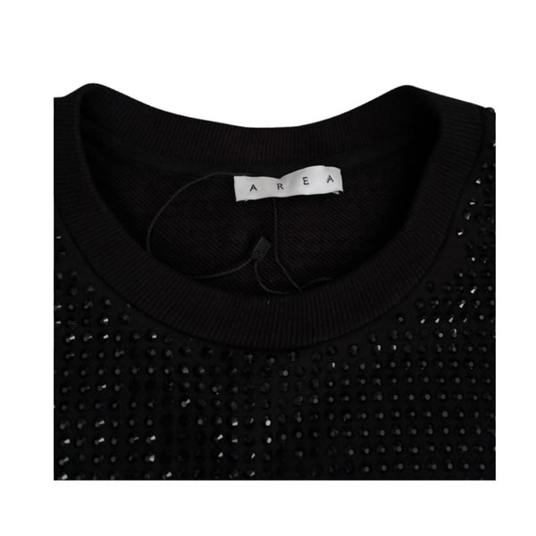 Black sweater with rhinestone details and 'AREA' label on a white background