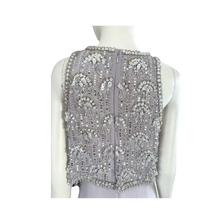 Silver beaded vest on a mannequin against a white background