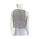 Silver beaded vest on a mannequin against a white background