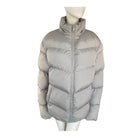 Grey puffer jacket on a mannequin against a white background