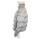 Grey puffer jacket on a mannequin against a white background
