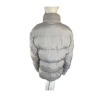 Grey puffer jacket on a mannequin against a white background