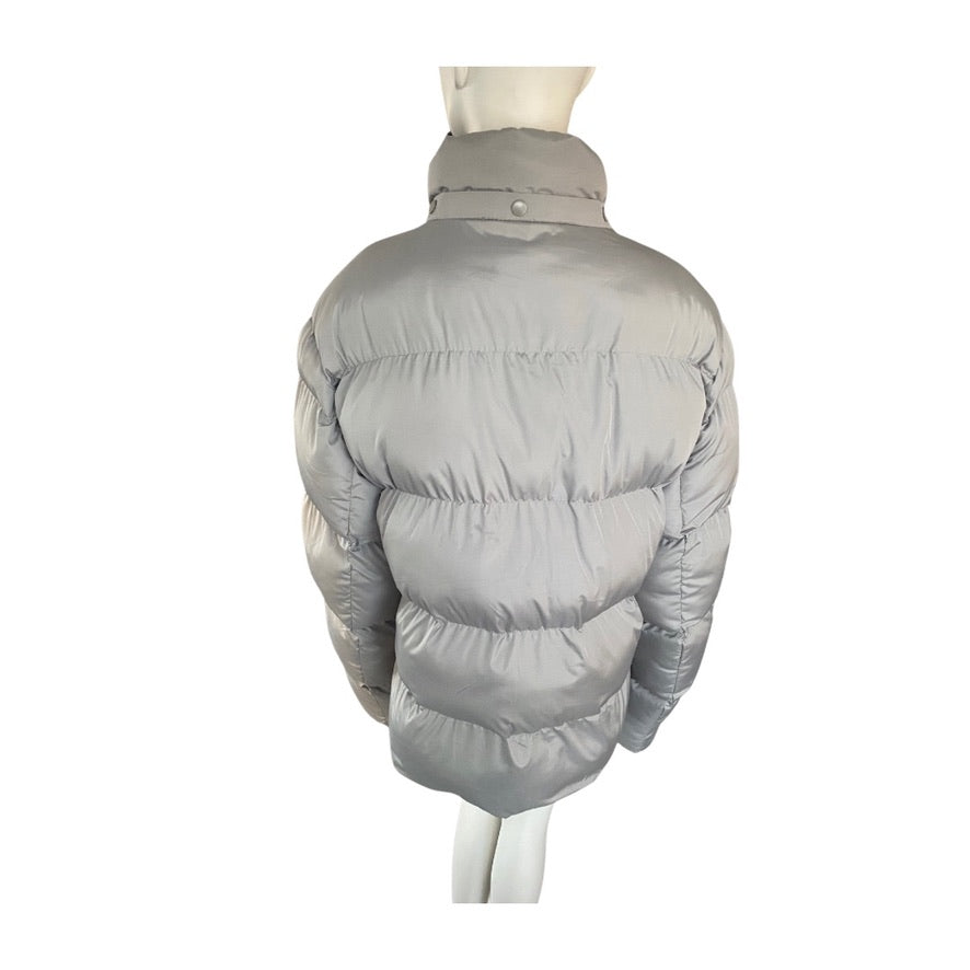Grey puffer jacket on a mannequin against a white background