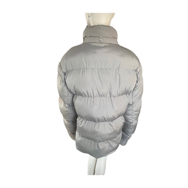 Grey puffer jacket on a mannequin against a white background