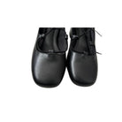Pair of black leather shoes on a white background