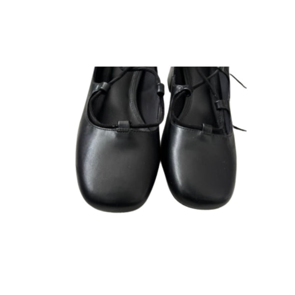 Pair of black leather shoes on a white background