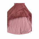 Pink layered dress on a white background